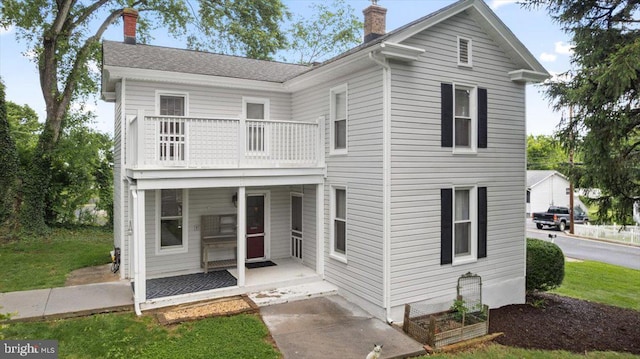 116 W 17th St, Front Royal, VA 22630 - view of front of house with a balcony and a chimney
