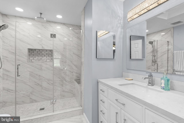 12125 Gatewater Dr, Potomac, MD 20854 - full bath featuring vanity, a marble finish shower, marble look tiles, recessed lighting, and baseboards