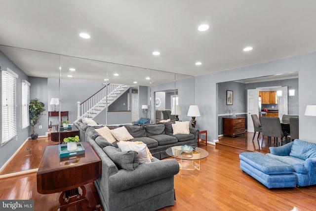 12125 Gatewater Dr, Potomac, MD 20854 - living room with stairs, light wood-style flooring, baseboards, and recessed lighting