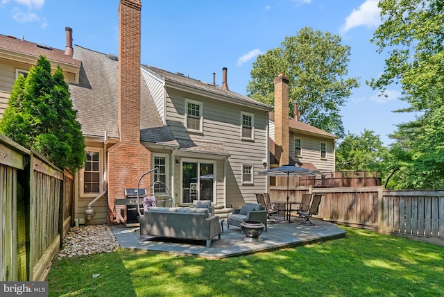 12125 Gatewater Dr, Potomac, MD 20854 - back of house featuring a patio, an outdoor living space, and a chimney
