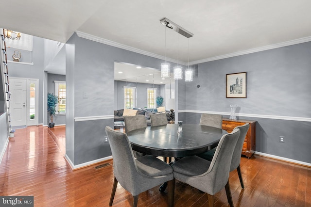 12125 Gatewater Dr, Potomac, MD 20854 - dining room with wood finished floors, baseboards, crown molding, and a chandelier