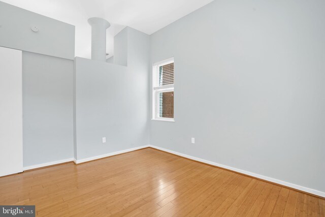 2114 N St NW Unit 46, Washington, DC 20037 - spare room with wood-type flooring and baseboards