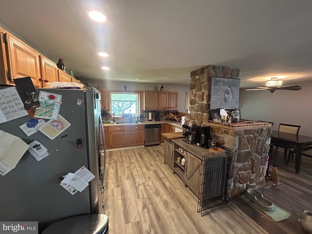 44 Sugarmaple Ln, Levittown, PA 19055 - kitchen with stainless steel appliances, light wood finished floors, a sink, and light brown cabinetry