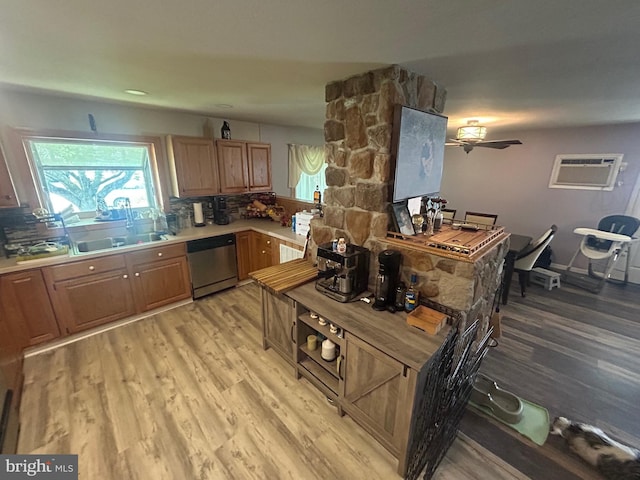 44 Sugarmaple Ln, Levittown, PA 19055 - kitchen featuring dishwasher, a wall unit AC, light wood-style floors, tasteful backsplash, and a sink
