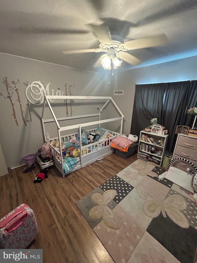 44 Sugarmaple Ln, Levittown, PA 19055 - bedroom with wood finished floors, a textured ceiling, and a ceiling fan