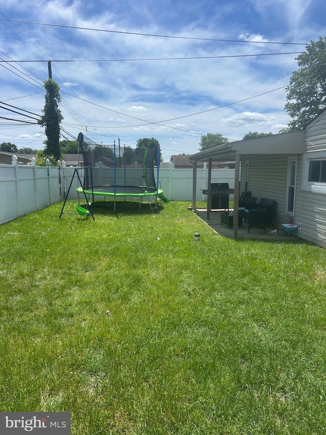 44 Sugarmaple Ln, Levittown, PA 19055 - view of yard with a trampoline and a patio