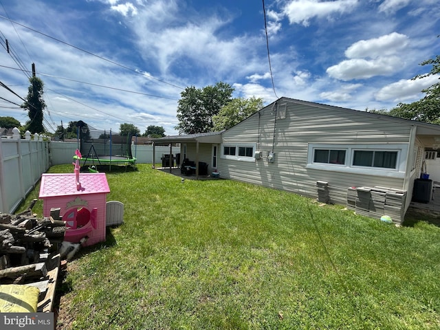 44 Sugarmaple Ln, Levittown, PA 19055 - back of house with a trampoline