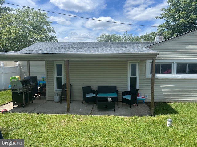 44 Sugarmaple Ln, Levittown, PA 19055 - back of property with a patio, an outdoor living space, and a shingled roof