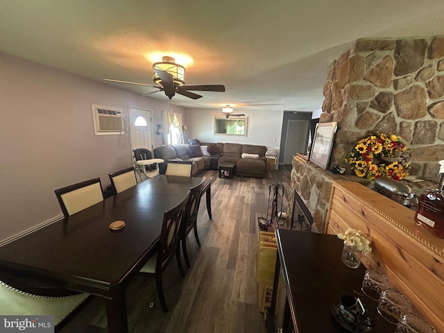 44 Sugarmaple Ln, Levittown, PA 19055 - dining area with a ceiling fan, dark wood-type flooring, a wall mounted AC, and a textured ceiling