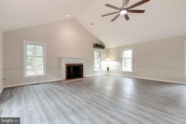 5183 Silver Run Ln, Salisbury, MD 21801 - unfurnished living room featuring ceiling fan, lofted ceiling, a fireplace, wood finished floors, and an AC wall unit