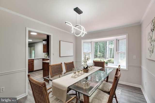 5183 Silver Run Ln, Salisbury, MD 21801 - dining area with ornamental molding, light wood-style flooring, a chandelier, and baseboards