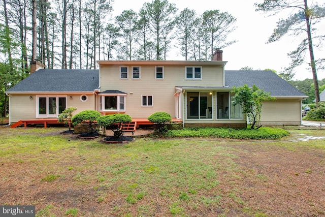 5183 Silver Run Ln, Salisbury, MD 21801 - rear view of house with a chimney, a yard, a sunroom, and a shingled roof