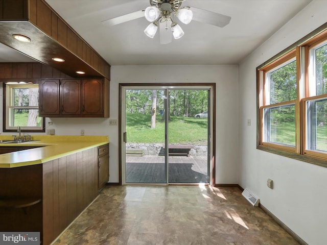1700 Mcdowell Rd, Greencastle, PA 17225 - kitchen featuring a sink, light countertops, ceiling fan, baseboards, and open shelves