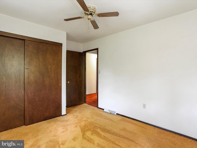 1700 Mcdowell Rd, Greencastle, PA 17225 - unfurnished bedroom featuring light colored carpet, a closet, a ceiling fan, and baseboards