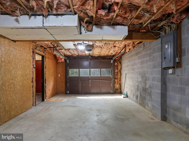 1700 Mcdowell Rd, Greencastle, PA 17225 - garage featuring electric panel, concrete block wall, and a garage door opener