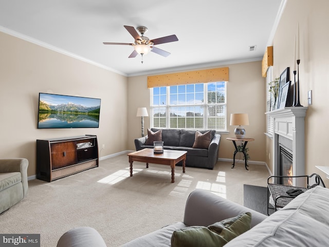 64 Fieldmaple Dr, Camden Wyoming, DE 19934 - living room featuring crown molding, light colored carpet, baseboards, ceiling fan, and a glass covered fireplace