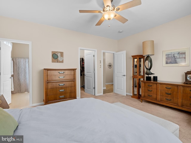 64 Fieldmaple Dr, Camden Wyoming, DE 19934 - bedroom with a walk in closet, baseboards, light carpet, and a closet