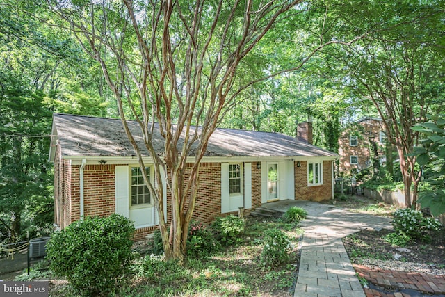 207 Wilderness Ln, Fredericksburg, VA 22401 - ranch-style home featuring brick siding, a chimney, and central AC