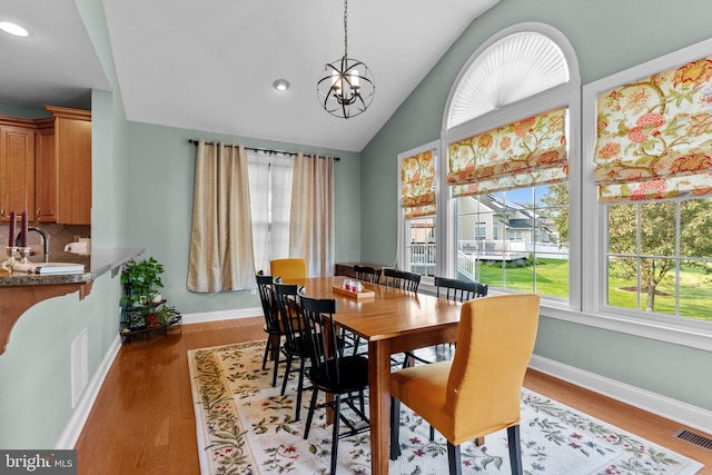 8 Warwick Ct, Newtown, PA 18940 - dining room with a chandelier, light wood-type flooring, lofted ceiling, recessed lighting, and baseboards