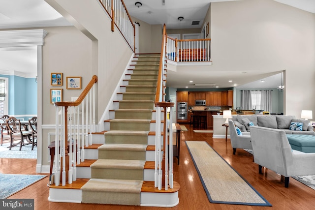 8 Warwick Ct, Newtown, PA 18940 - staircase with plenty of natural light, wood finished floors, a towering ceiling, and recessed lighting