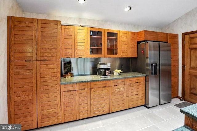 2361 Welsh Rd, Mohnton, PA 19540 - kitchen featuring stainless steel fridge with ice dispenser, glass insert cabinets, light tile patterned floors, and brown cabinets