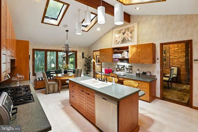 2361 Welsh Rd, Mohnton, PA 19540 - kitchen featuring stainless steel dishwasher, a skylight, black gas stovetop, a kitchen island with sink, and high vaulted ceiling