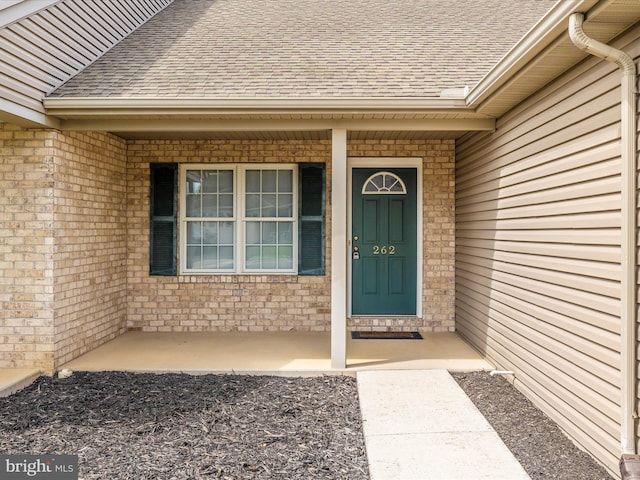262 Lantern Ln, Chambersburg, PA 17201 - property entrance featuring a shingled roof and brick siding