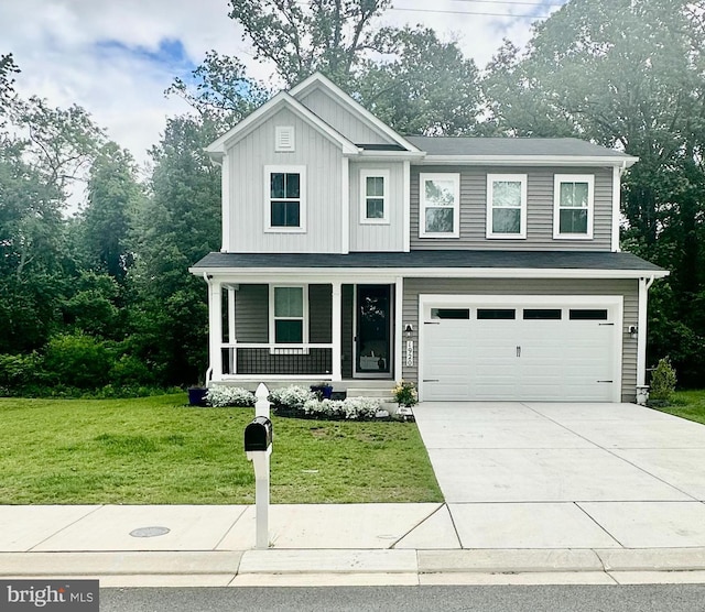 1920 Sue Ave, Essex, MD 21221 - view of front of home with covered porch, a garage, a front yard, driveway, and board and batten siding