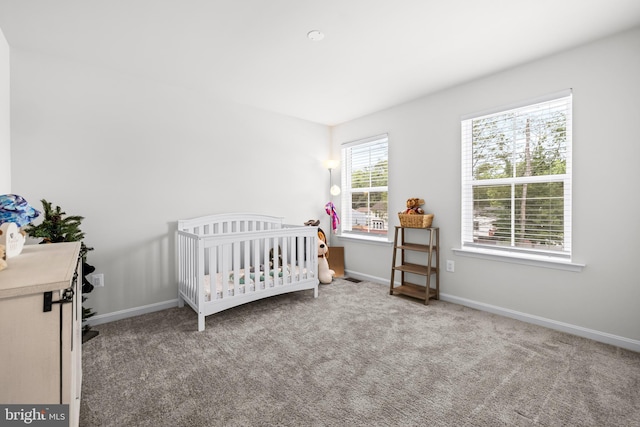 1920 Sue Ave, Essex, MD 21221 - carpeted bedroom featuring a crib and baseboards
