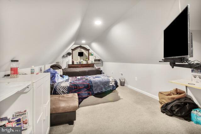 107 Main Ave SW, Glen Burnie, MD 21061 - carpeted bedroom with lofted ceiling and baseboards