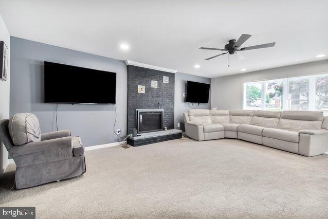 107 Main Ave SW, Glen Burnie, MD 21061 - living area featuring carpet flooring, ceiling fan, a fireplace, recessed lighting, and baseboards