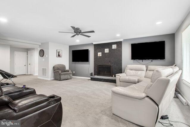 107 Main Ave SW, Glen Burnie, MD 21061 - carpeted living room with ceiling fan, a fireplace, recessed lighting, and baseboards