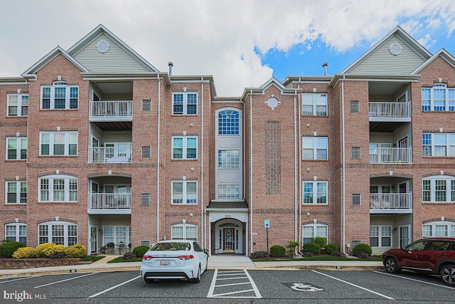 9601 Amberleigh Ln Unit 9601F, Perry Hall, MD 21128 - view of apartment building / complex featuring uncovered parking