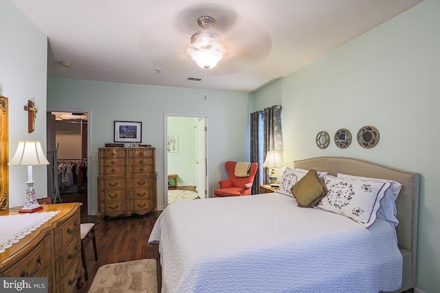9601 Amberleigh Ln Unit 9601F, Perry Hall, MD 21128 - bedroom featuring dark wood finished floors, a walk in closet, a closet, ensuite bath, and a ceiling fan