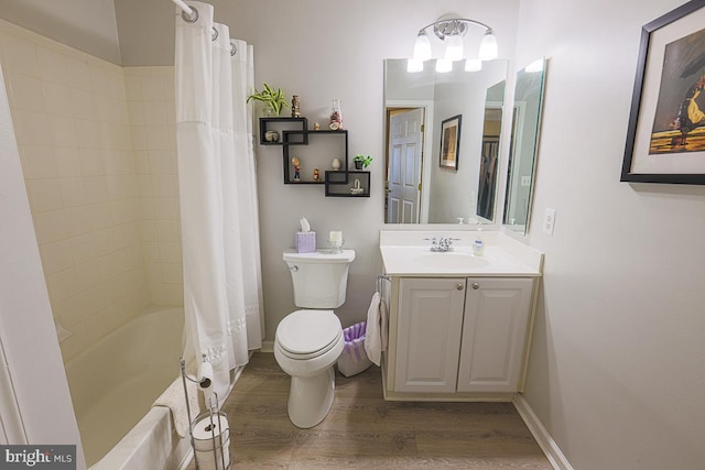 9601 Amberleigh Ln Unit 9601F, Perry Hall, MD 21128 - full bathroom featuring wood finished floors, vanity, shower / bath combo with shower curtain, and toilet