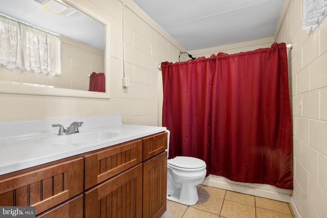 30 Halleck Dr, East Berlin, PA 17316 - full bath featuring vanity, tile patterned floors, toilet, and concrete block wall