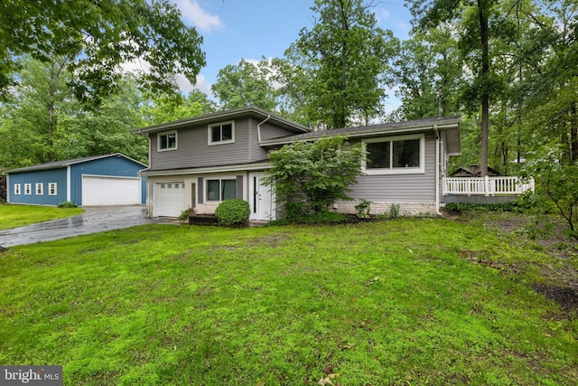 30 Halleck Dr, East Berlin, PA 17316 - view of front of house with a front yard, a detached garage, and a wooden deck
