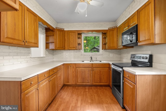 30 Halleck Dr, East Berlin, PA 17316 - kitchen with open shelves, stainless steel electric range, black microwave, and a sink