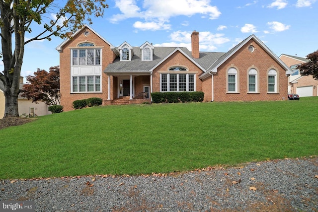 1292 Middleton Ct, Vienna, VA 22182 - view of front facade with a chimney, brick siding, and a front yard