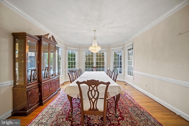 1292 Middleton Ct, Vienna, VA 22182 - dining room featuring a chandelier, light wood-style floors, crown molding, and baseboards