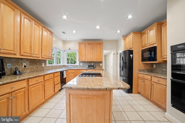 1292 Middleton Ct, Vienna, VA 22182 - kitchen featuring black appliances, a center island, light stone counters, backsplash, and recessed lighting