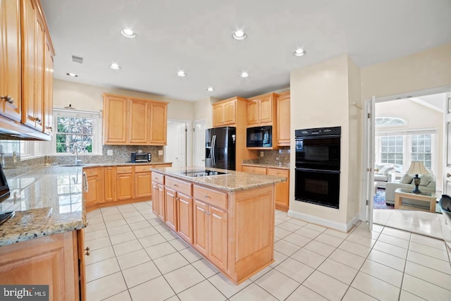 1292 Middleton Ct, Vienna, VA 22182 - kitchen featuring black appliances, light brown cabinets, a sink, a center island with sink, and recessed lighting