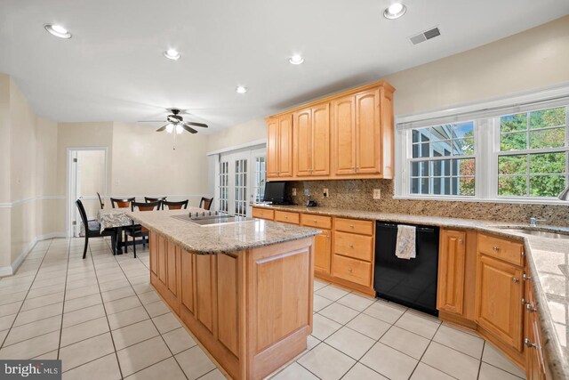 1292 Middleton Ct, Vienna, VA 22182 - kitchen with black dishwasher, a kitchen island, light tile patterned floors, a sink, and tasteful backsplash