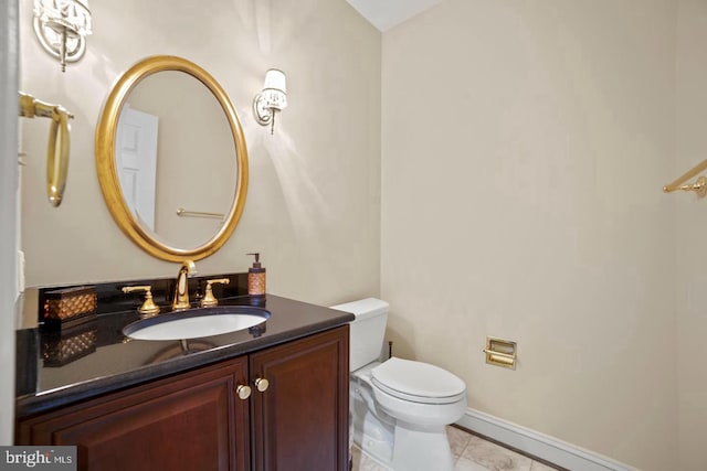 1292 Middleton Ct, Vienna, VA 22182 - half bathroom featuring toilet, vanity, marble finish flooring, and baseboards