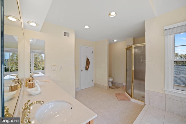1292 Middleton Ct, Vienna, VA 22182 - full bathroom featuring a shower stall, double vanity, tile patterned flooring, toilet, and recessed lighting