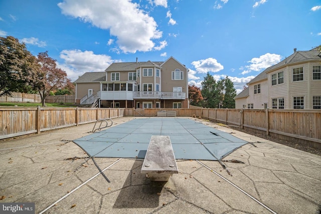 1292 Middleton Ct, Vienna, VA 22182 - view of pool with a patio, a diving board, and a fenced backyard