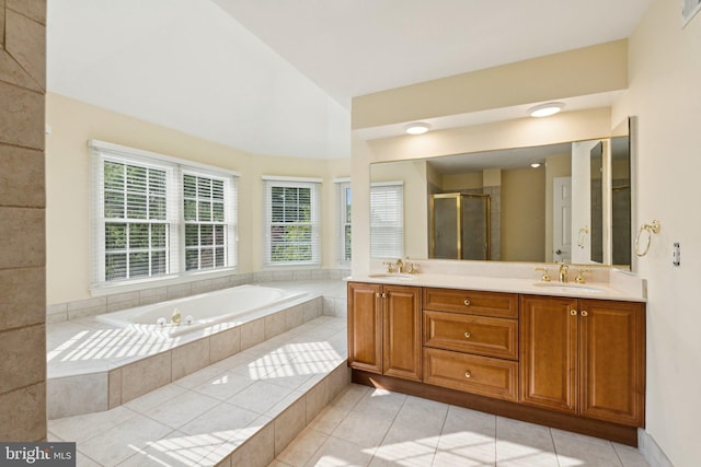 1292 Middleton Ct, Vienna, VA 22182 - bathroom featuring double vanity, tile patterned floors, a garden tub, a shower stall, and lofted ceiling