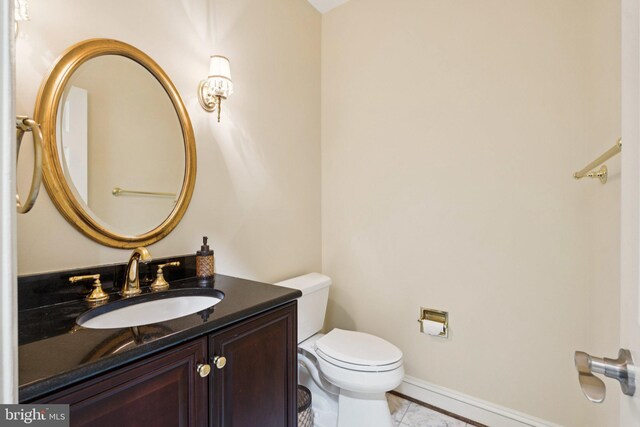 1292 Middleton Ct, Vienna, VA 22182 - bathroom featuring toilet, vanity, and baseboards