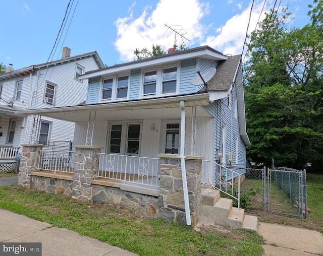 131 Vine St, Bridgeton, NJ 08302 - view of front of house featuring covered porch, a gate, a chimney, and a shingled roof