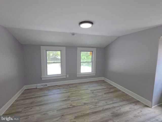 131 Vine St, Bridgeton, NJ 08302 - unfurnished room featuring vaulted ceiling, baseboards, and wood finished floors
